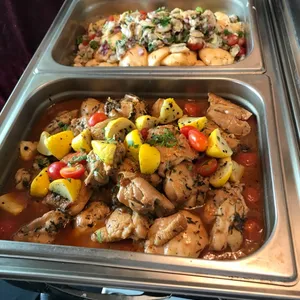 Lemon Thyme Roasted Chicken with tomato garlic confit jus and grilled yellow squash