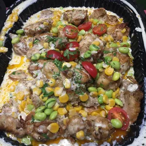 Herb-Roasted Chicken <i> with edamame and corn ragù </i>
