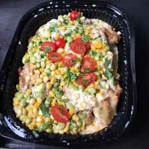 Herb-Roasted Chicken <i> with edamame and corn ragù </i>