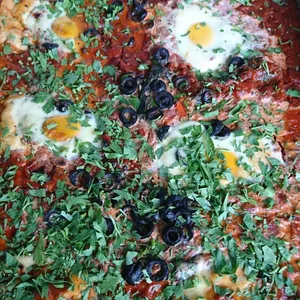Shakshuka (V) <i>north african-style baked eggs in tomato sauce</i>