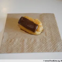 Click to see Mini Chocolate Éclair (V) <i>with creamy custard filling</i>