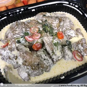 Coriander Pesto Dory <i>in light butter sauce with cucumber salad</i>