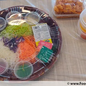 Prosperity Reunion Smoked Salmon Yu Sheng   with kale, cod fish fillet strips and magical