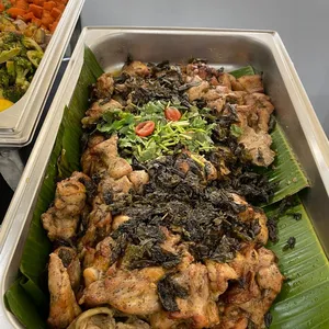 Slow-roast Tie Guan Yin Chicken <i> with coriander and crispy tea leaf </i>