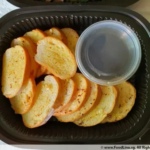 Garlic Herb Ciabatta (V)<i>served toasted and sliced with balsamic herb vinegar dip</i>
