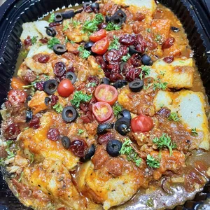 Roasted White Fish<i> swimming in a housemade tomato sauce</i>