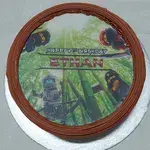 Ninjago Celebrates (Size: 7 inch) (Flavours: Chocolate) (Big candles: 2) (Small candles: None) (Message on Complimentary Gift Card: No) (Message on Cake (Short & Sweet): Yes (do write the message in the ordering form, under comments box))