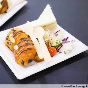 Almond Pain Au Chocolate Croissant<br> A sweet puff pastry filled with dark chocolate<br> Vegetarian, contains dairy
