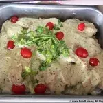 Grilled Dory with Pesto Cream topped with Parsley and Sliced Cherry Tomatoes