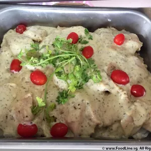 Grilled Dory with Pesto Cream topped with Parsley and Sliced Cherry Tomatoes