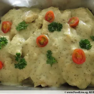 Grilled Dory with Pesto Cream topped with Parsley and Sliced Cherry Tomatoes