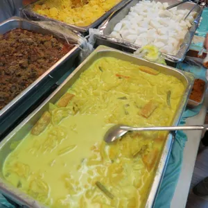 Lontong Served with Sambal Chilli & Serundeng (Fried Coconuts)
