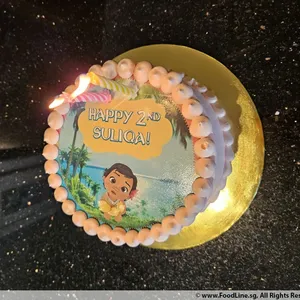 Baby Moana (Size: 7 inch) (Flavours: Cookies and cream) (Big candles: 2) (Small candles: None) (Message on Complimentary Gift Card: No) (Message on Cake (Short & Sweet): Yes (do write the message in the ordering form, under comments box))