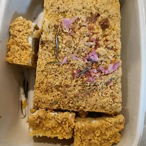 Crumble-Topped Carrot Cakei<br>rosemary crumble, roasted walnuts, Christmas spice spongecake, French rose petals