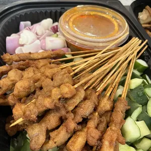 Singapore Styled Chicken Satay<br>peanut sauce, raw onion, cucumber