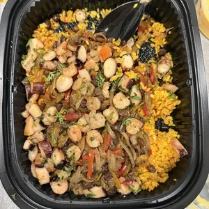 Festive Seafood Paella <br> saffron infused arborio, buttered octopus and shrimp, capsicum coulis