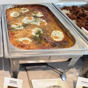 Oven Baked Shakshouka(V)<br>  sauteed garlic spinach, romesco sauce, egg, parmesan cheese shred