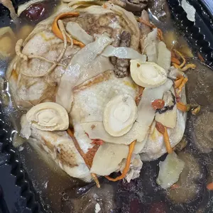 Organic Imperial Herbal Chicken with Stewed Abalone<br>brined, marinated & steamed in a lucious old hen broth with 8 different herbs. served with fork tender abalone