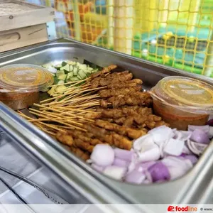 Singapore-Styled Chicken Satay<br>peanut sauce, raw onion, cucumber<br>spicy, contains allium, nuts