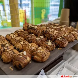 Almond Pain Au Chocolat Croissant <br> a sweet puff pastry filled with dark chocolate <br> Vegetarian, Contains dairy, egg, nuts and wheat