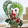 Click to see more photos of TB054: Heart Shape 8 Red Roses Table Arrangement